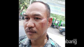 Eko Yulianto, Kasun Melik, Desa Bedahlawak, Kecamatan Tembelang, Kabupaten Jombang, saat melapor ke Polsek Tembelang.